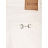 Denim trousers with metal Horsebit detail on the back