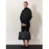Leather shoulder bag with lettering logo on the front
