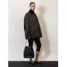 Hammered leather bucket bag with strap on the front
