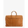 Leather travel bag with engraved logo on the front