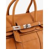 Leather travel bag with engraved logo on the front
