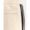 Recycled nylon trousers with iconic detail on the side