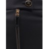 Trousers with logoed button