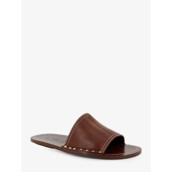 Low leather sandals with metal studs on the sides