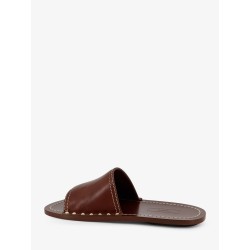 Low leather sandals with metal studs on the sides