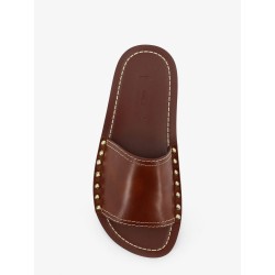 Low leather sandals with metal studs on the sides