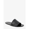 Low leather sandals with metal studs on the sides