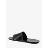 Low leather sandals with metal studs on the sides