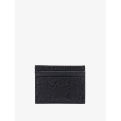 Leather card holder with metal logo tag