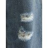 Destroyed-effect blue denim jeans