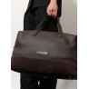 Leather travel bag with suede inserts