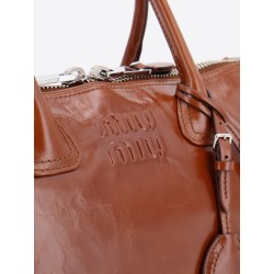 Shiny leather handbag with front lettering logo
